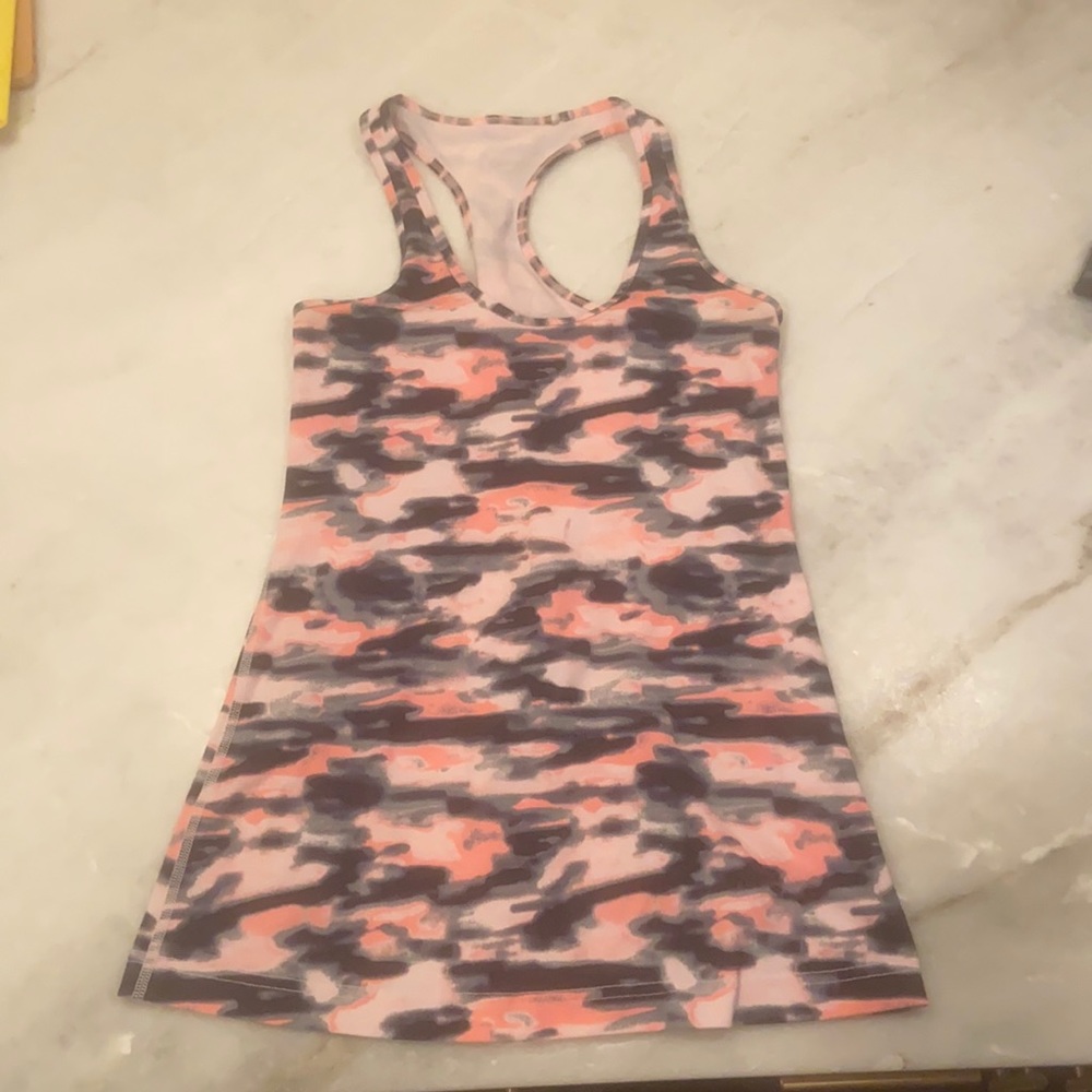 Five size 6 Lululemon racer tanks